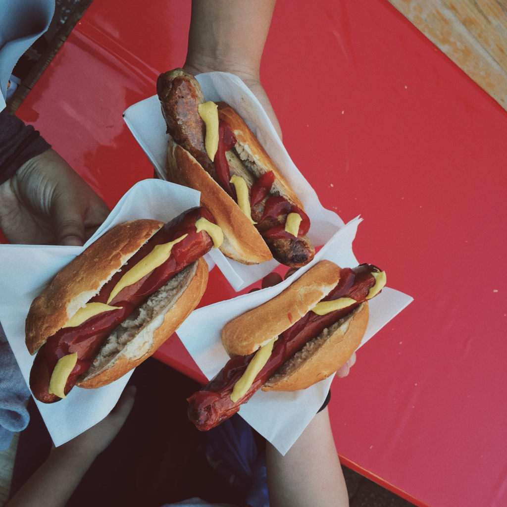 Sharing hot dogs with friends