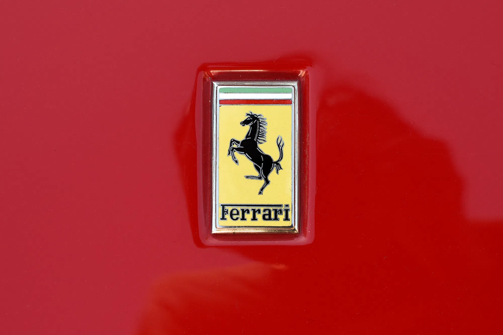 Ferrari logo on a red background
