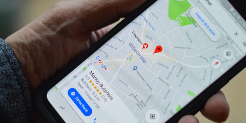Person checking restaurants on map on phone
