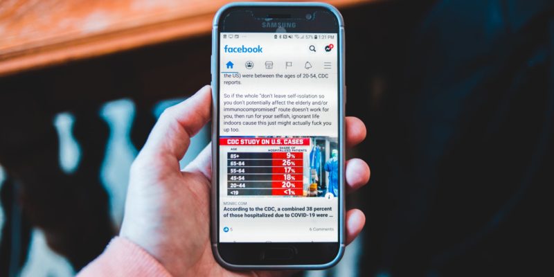 Facebook Open Graph Image with an article displayed on phone
